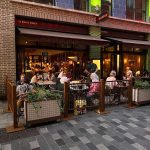 Dishoom Carnaby Laser Cut Panels in Copper Finish. Rustic Posts with Square Bases