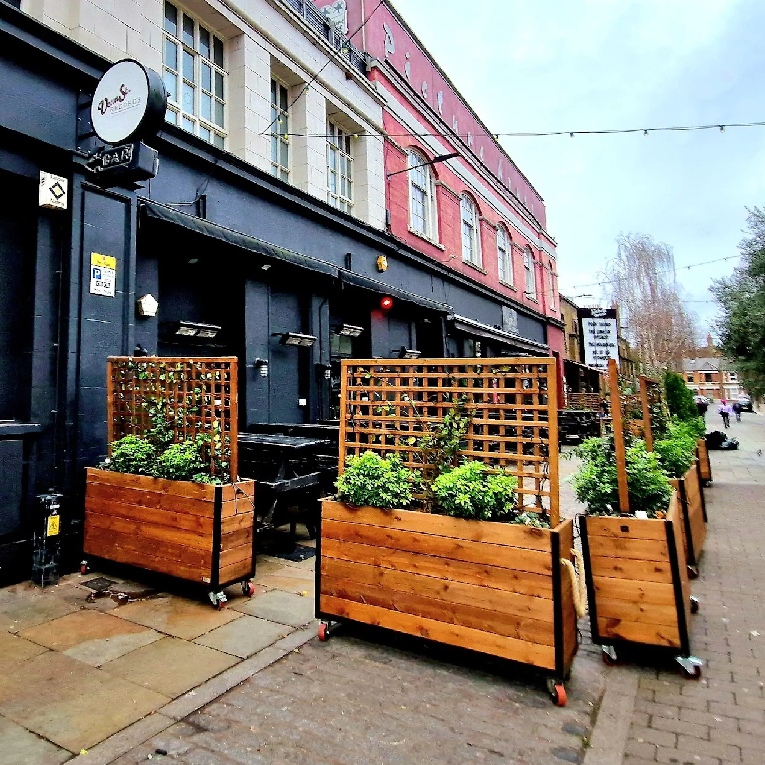 Venn Street 2 - Baylis Trellis Industrial Cafe Planter Wooden Baylis Trellis Industrial Cafe Planters outside Venn Street Records with Faux Plants, Commercial Planters, Commercial Cafe Planter, Handmade Cafe Planter, Wooden Planters, Bespoke Cafe Planters, Custom Made Planters, Wood Planter, Outdoor Planters