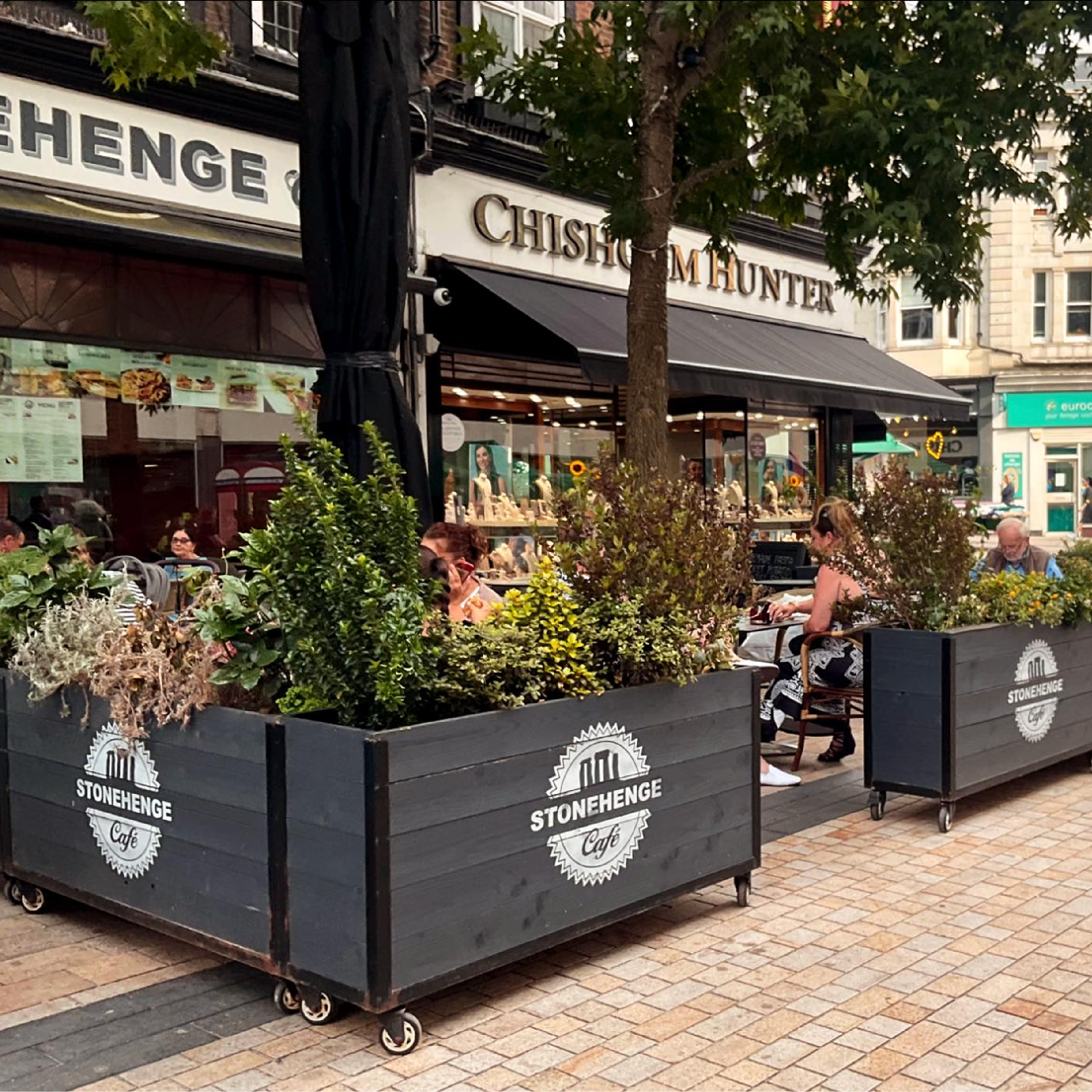 Stonehenge Cafe - Baylis Industrial Cafe Planter Stonehenge Baylis Industrial Cafe Planters, Wooden Planters, Commercial Planters, Bespoke Planters, Planter with Trellis, Outdoor Planters, Hospitality Planters, Custom-Made Planters, Cafe Planters, Planters on Wheels, Moveable Planters, Black Ropes