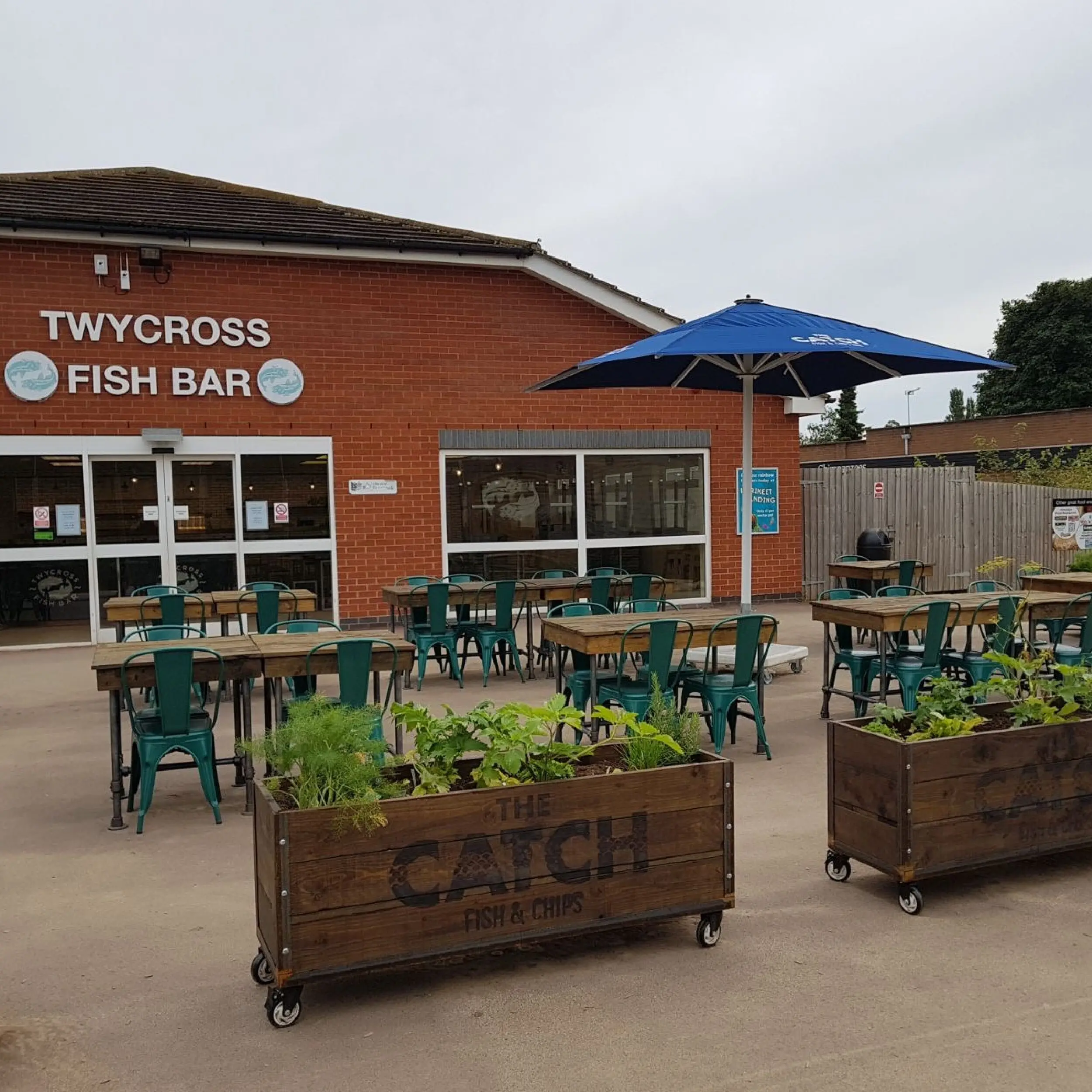 The Catch - Baylis Industrial Cafe Planter The Catch Fish & Chip Shop at Twycross Zoo - Baylis Industrial Cafe Planters, Commercial Giant Umbrellas and Handmade Wooden Table Tops, Wooden Cafe Planters, Restaurant Planters, Commercial Planters, Custom Planters, Branded Cafe Planters