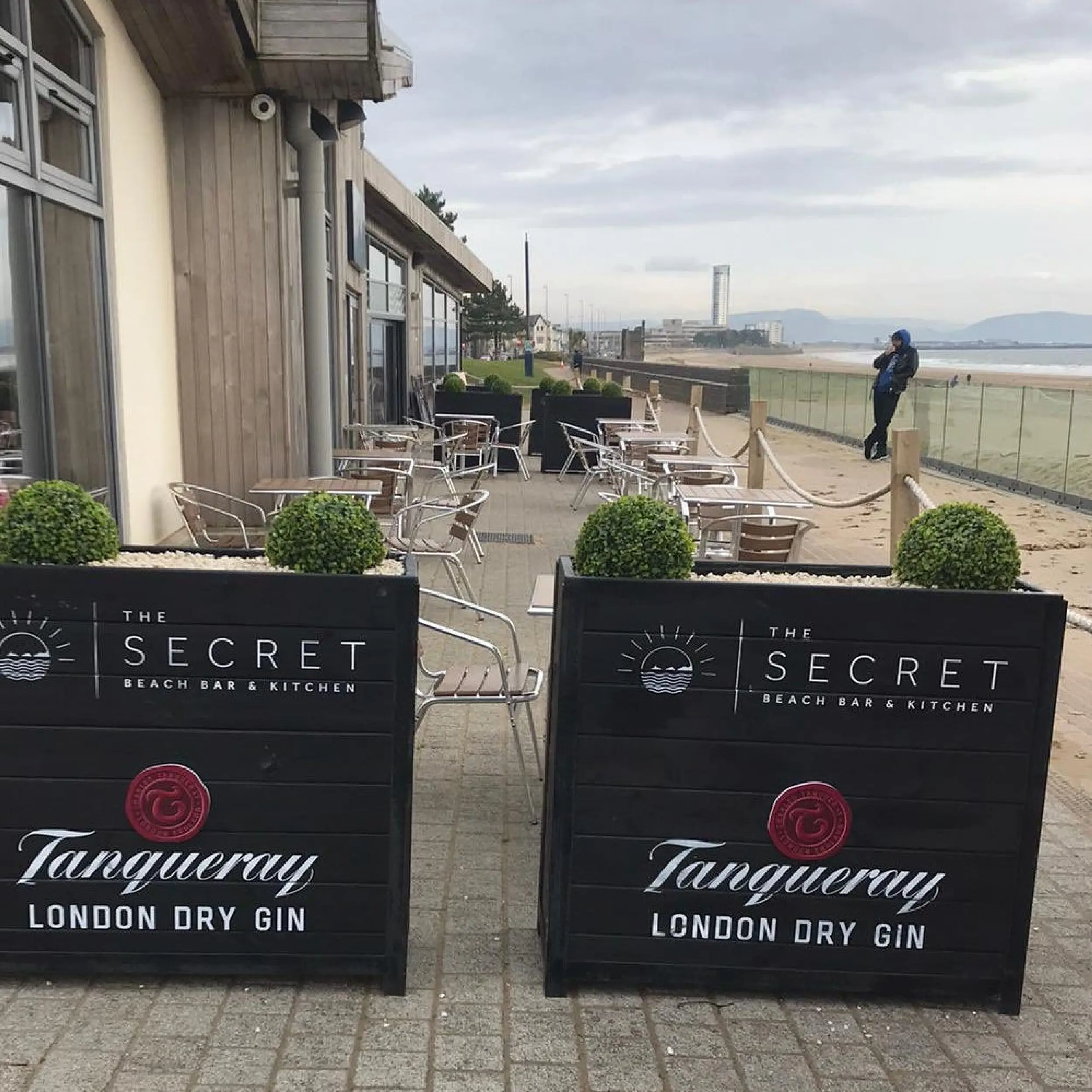 The Secret - Baylis Industrial Cafe Planter Baylis Cafe Planters outside The Secret Beach Bar. Commercial Planters are Bespoke Planters & can be used with Cafe Barriers.