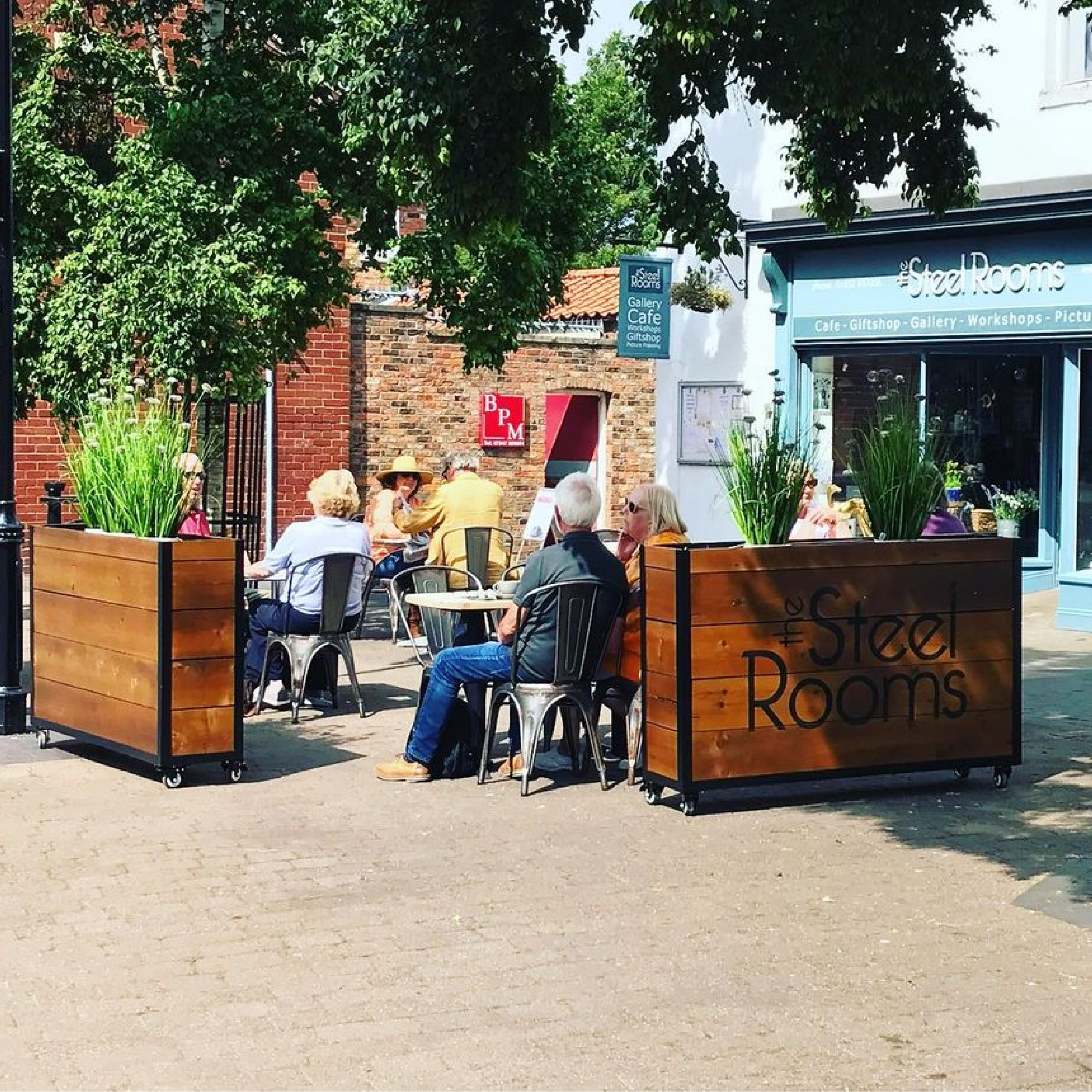 The Steel Rooms - Baylis Industrial Cafe Planter The Steel Room Baylis Industrial Cafe Planters, Wooden Planters, Commercial Planters, Bespoke Planters, Planter with Trellis, Outdoor Planters, Hospitality Planters, Custom-Made Planters, Cafe Planters, Planters on Wheels, Moveable Planters, Black Ropes