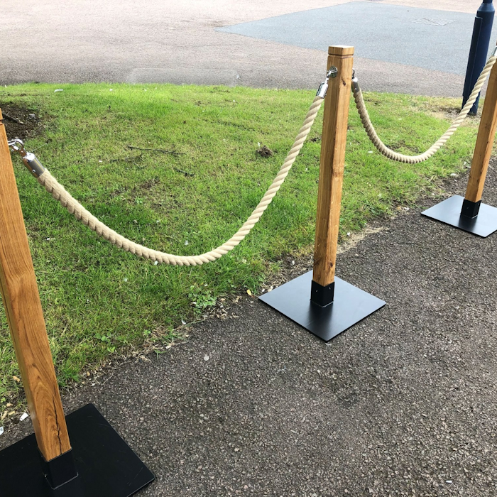 Wooden Rustic Rope Barrier with Square Base and Polyhemp Rope Wooden Rustic Character Oak Rope Barrier Post with Square Base & Polyhemp Barrier Rope. For use with our Cafe Barrier Systems.