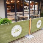 JLR Live Lounge Rustic Posts and Wooden Panels, Painted Green with their Logo in White