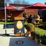 Ravello Parasol in Red with Yellow logo for Yolk Kitchen