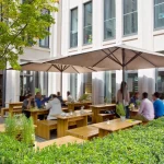 Caravita Samara Commercial Giant Umbrella in White Outside Restaurant