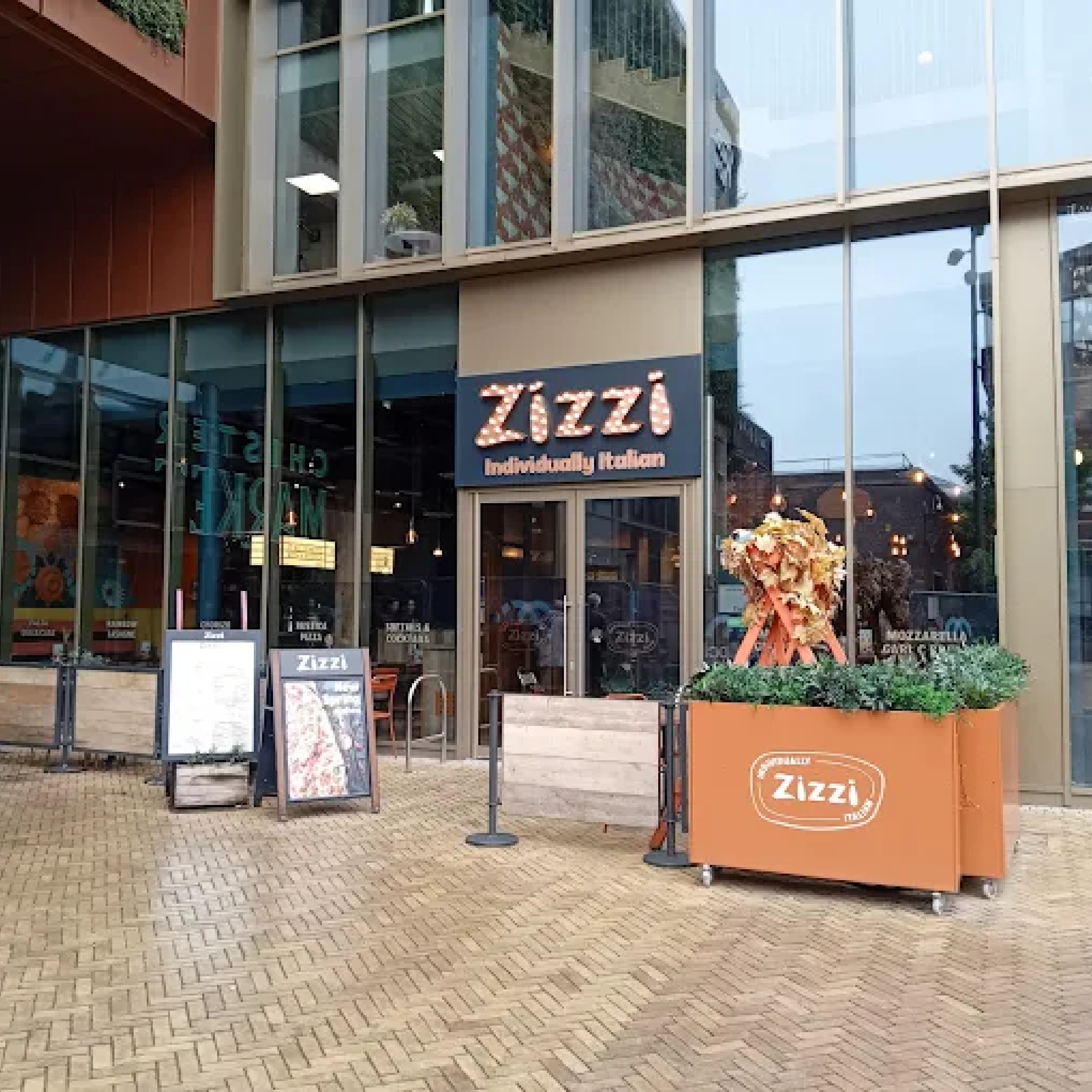 Zizzi Chester - Forjado Powder Coated Café Planter Zizzi Chester with Forjado Metal Powder Coated Cafe Planters in Copper, Advance Cafe Barrier Posts Powder Coated Grey and Metal Framed Wooden Cafe Panels