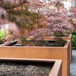 Corten Steel Square Planters With Wheels Close Up Planted