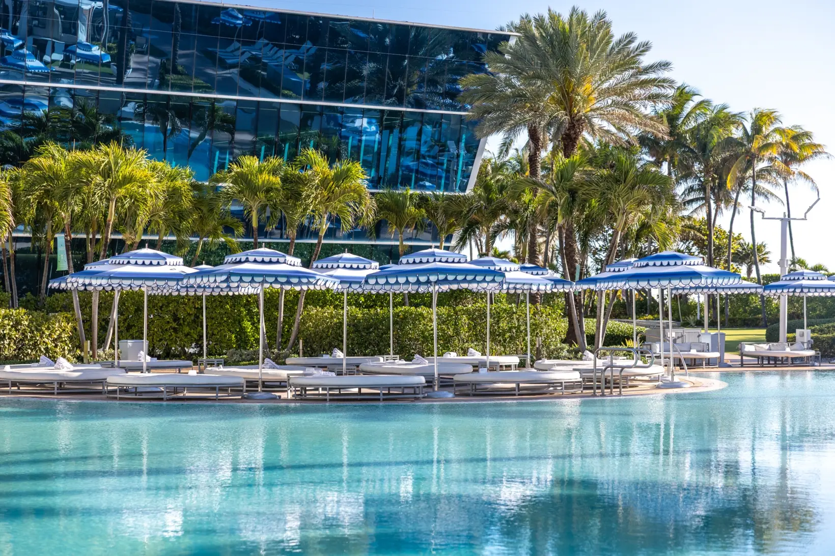 Tuuci M1 Cupola Giant Umbrella with Blue and White Stripes Tuuci Hexagonal OceanMaster M1 Cupola Giant Umbrella in Blue and White Stripes around a Pool, Giant Umbrellas, Commercial Giant Umbrellas, Hospitality Giant Umbrellas, Parasols, Restaurant Umbrellas, Outdoor Umbrellas, Fabric Umbrellas, Giant Umbrellas with Logos, Tuuci Umbrellas, Tuuci Giant Umbrellas