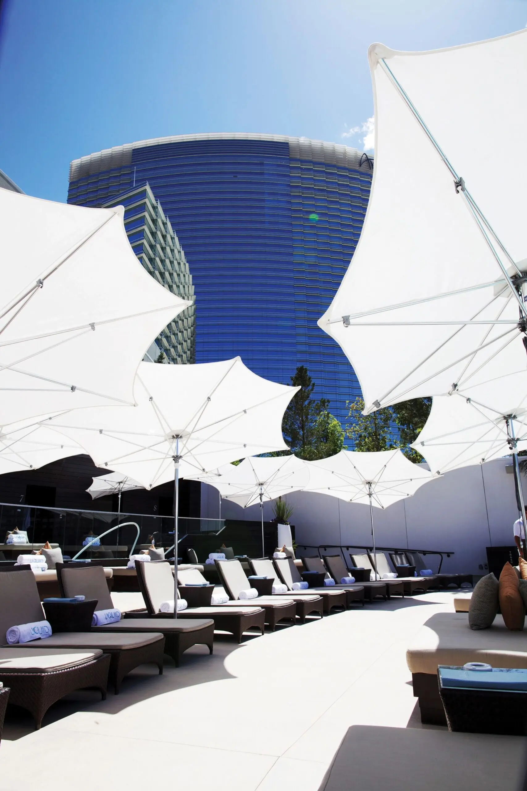 White Tuuci OceanMaster M1 Razor Giant Umbrella OceanMaster M1 Razor Giant Umbrella in White around some Pool Loungers, Giant Umbrellas, Commercial Giant Umbrellas, Hospitality Giant Umbrellas, Parasols, Restaurant Umbrellas, Outdoor Umbrellas, Fabric Umbrellas, Giant Umbrellas with Logos, Tuuci Umbrellas, Tuuci Giant Umbrellas