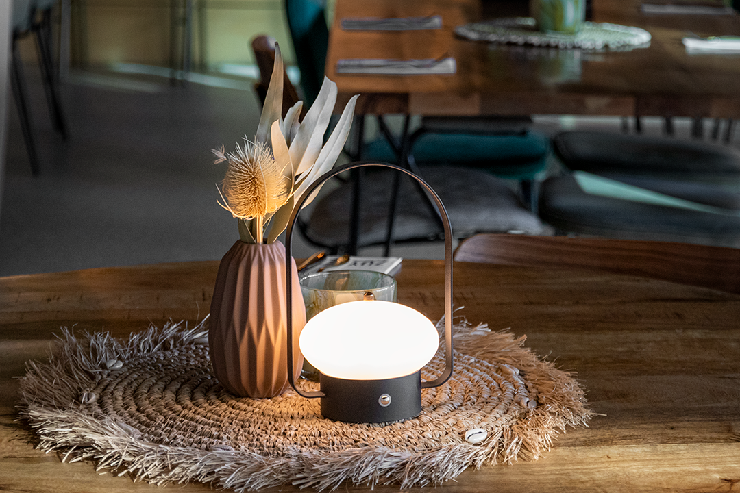 Badalona Rechargeable Table Lamp on a Wooden Table Inside a Restaurant Badalona Rechargeable Table Lamp on a Wooden Table Inside a Restaurant, Service Table Lamp, Table Lighting, Restaurant Lighting, Lighting for Table at Restaurant, Commercial Table Lighting, Hospitality Lighting, Rechargeable Table Lamps, LED Lighting, Outdoor Table Lamps, Indoor Table Lighting, Cafe Lighting, Table Lamps for Cafes