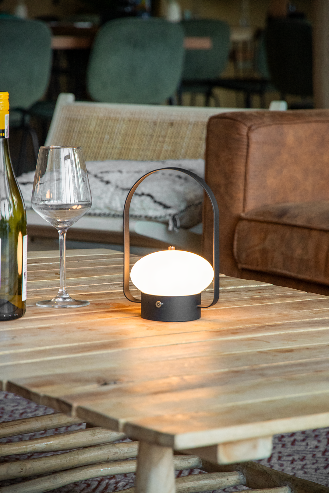 Badalona Rechargeable Table Lamp on a Wooden Table Inside a Restaurant Lit Up Badalona Rechargeable Table Lamp on a Wooden Table Inside a Restaurant Lit Up, Service Table Lamp, Table Lighting, Restaurant Lighting, Lighting for Table at Restaurant, Commercial Table Lighting, Hospitality Lighting, Rechargeable Table Lamps, LED Lighting, Outdoor Table Lamps, Indoor Table Lighting, Cafe Lighting, Table Lamps for Cafes