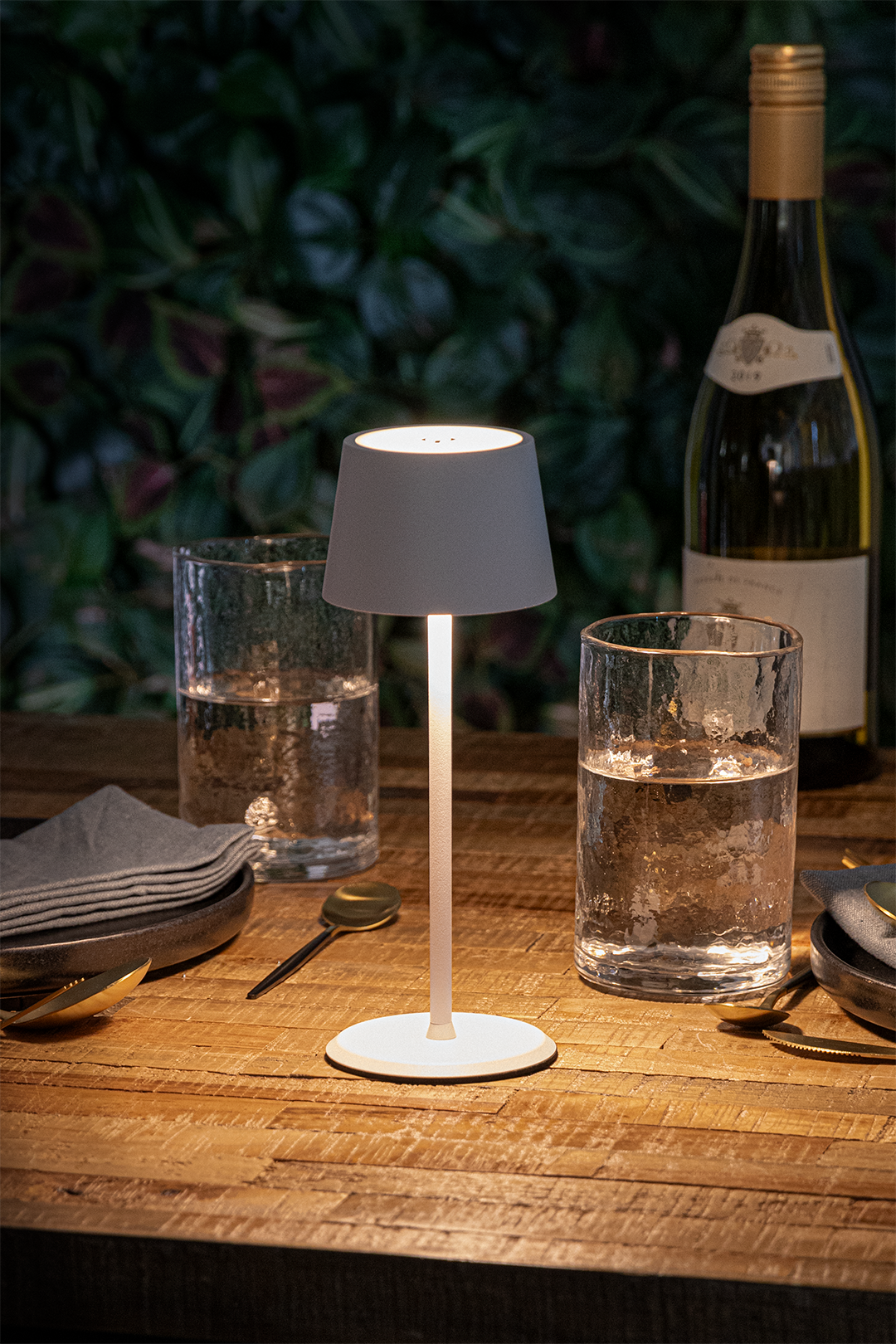 Monaco Rechargeable Table Lamp in White on a Wooden Table Outside a Restaurant Lit Up Monaco Rechargeable Table Lamp in White on a Wooden Table Outside a Restaurant Lit Up, Table Lighting, Restaurant Lighting, Lighting for Table at Restaurant, Commercial Table Lighting, Hospitality Lighting, Rechargeable Table Lamps, LED Lighting, Outdoor Table Lamps, Indoor Table Lighting, Cafe Lighting, Table Lamps for Cafes