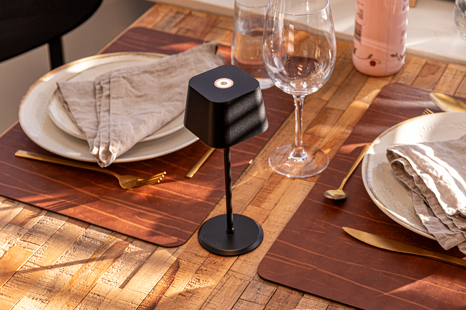 Valletta Rechargeable Table Lamp in Black on a Wooden Table Inside a Restaurant Valletta Rechargeable Table Lamp in Black on a Wooden Table Inside a Restaurant, Table Lighting, Restaurant Lighting, Lighting for Table at Restaurant, Commercial Table Lighting, Hospitality Lighting, Rechargeable Table Lamps, LED Lighting, Outdoor Table Lamps, Indoor Table Lighting, Cafe Lighting, Table Lamps for Cafes
