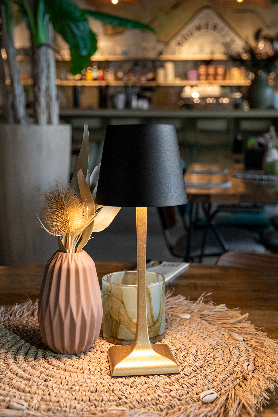 Labaro Rechargeable Table Lamp on a Wooden Table Inside a Restaurant Labaro Rechargeable Table Lamp in Black on a Wooden Table Inside a Restaurant, Table Lighting, Restaurant Lighting, Lighting for Table at Restaurant, Commercial Table Lighting, Hospitality Lighting, Rechargeable Table Lamps, LED Lighting, Outdoor Table Lamps, Indoor Table Lighting, Cafe Lighting, Table Lamps for Cafes