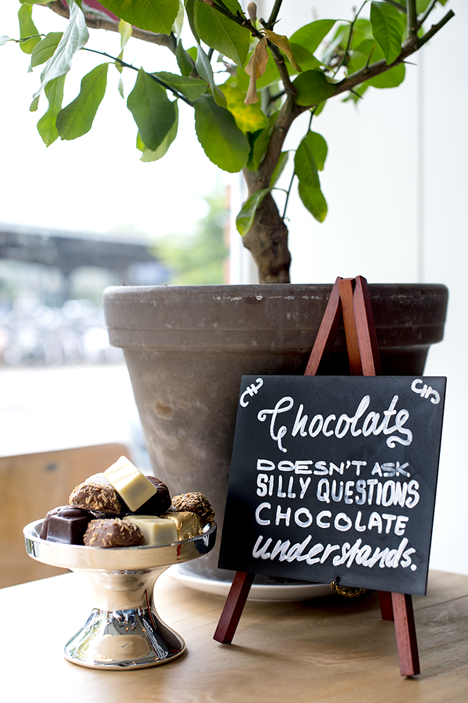 Mini Easel Table Board in Mahogany Next to a Pot and Chocolates Mini Easel Table Board in Mahogany Next to a Pot and Chocolates, Table Chalkboard, Freestanding Table Board, Wooden Table Board, Double Sided Table Chalkboard, Table Top Accessory, Advertising Boards, Restaurant Signage, Cafe Signage, Menu Boards, Menu Signage