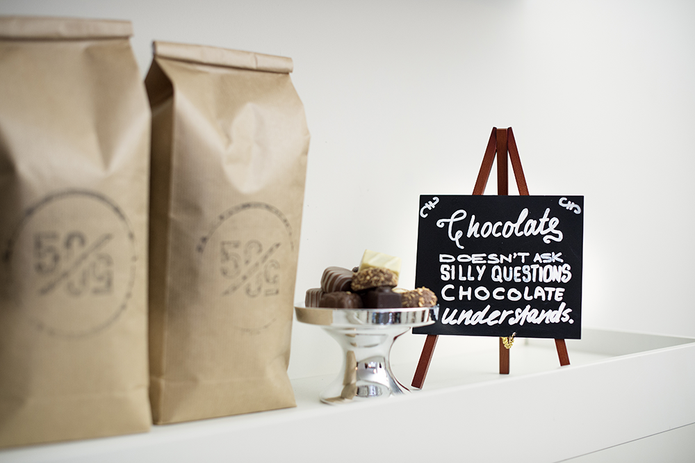 Mini Easel Table Board in Mahogany next to Chocolates Mini Easel Table Board in Mahogany next to Chocolates, Table Chalkboard, Freestanding Table Board, Wooden Table Board, Double Sided Table Chalkboard, Table Top Accessory, Advertising Boards, Restaurant Signage, Cafe Signage, Menu Boards, Menu Signage