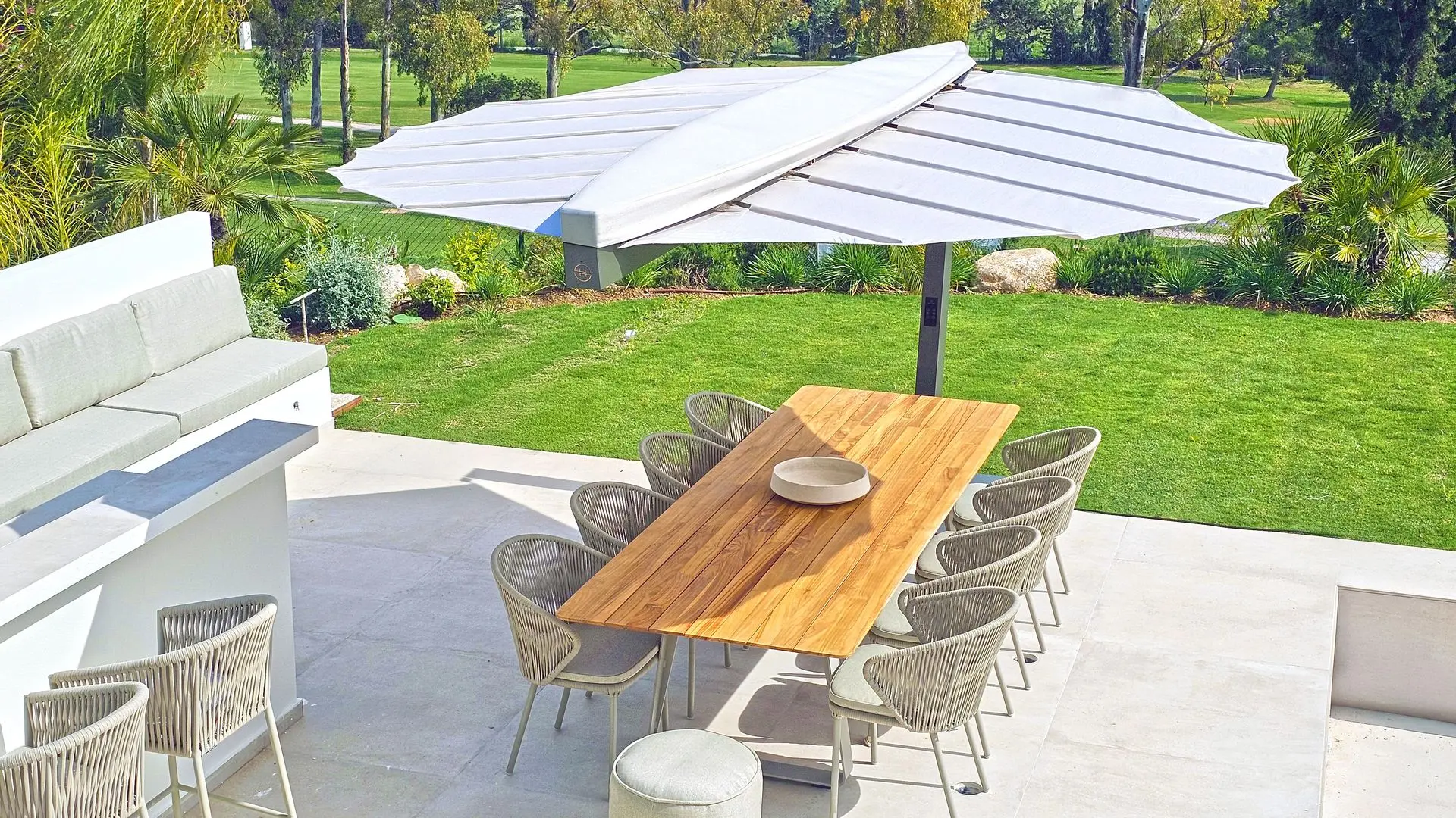 Wooden Table with Chairs Under a Folium Patio Heater Folium Free Standing Patio Heater, Folium Patio Heater in Grey with White Fabric, Patio Heaters, Outdoor Heaters, Free Standing Patio Heater, Alfresco Heaters, Commercial Heaters, Commercial Patio Heaters, Free Standing Heating, Hospitality Heaters, Restaurant Heaters