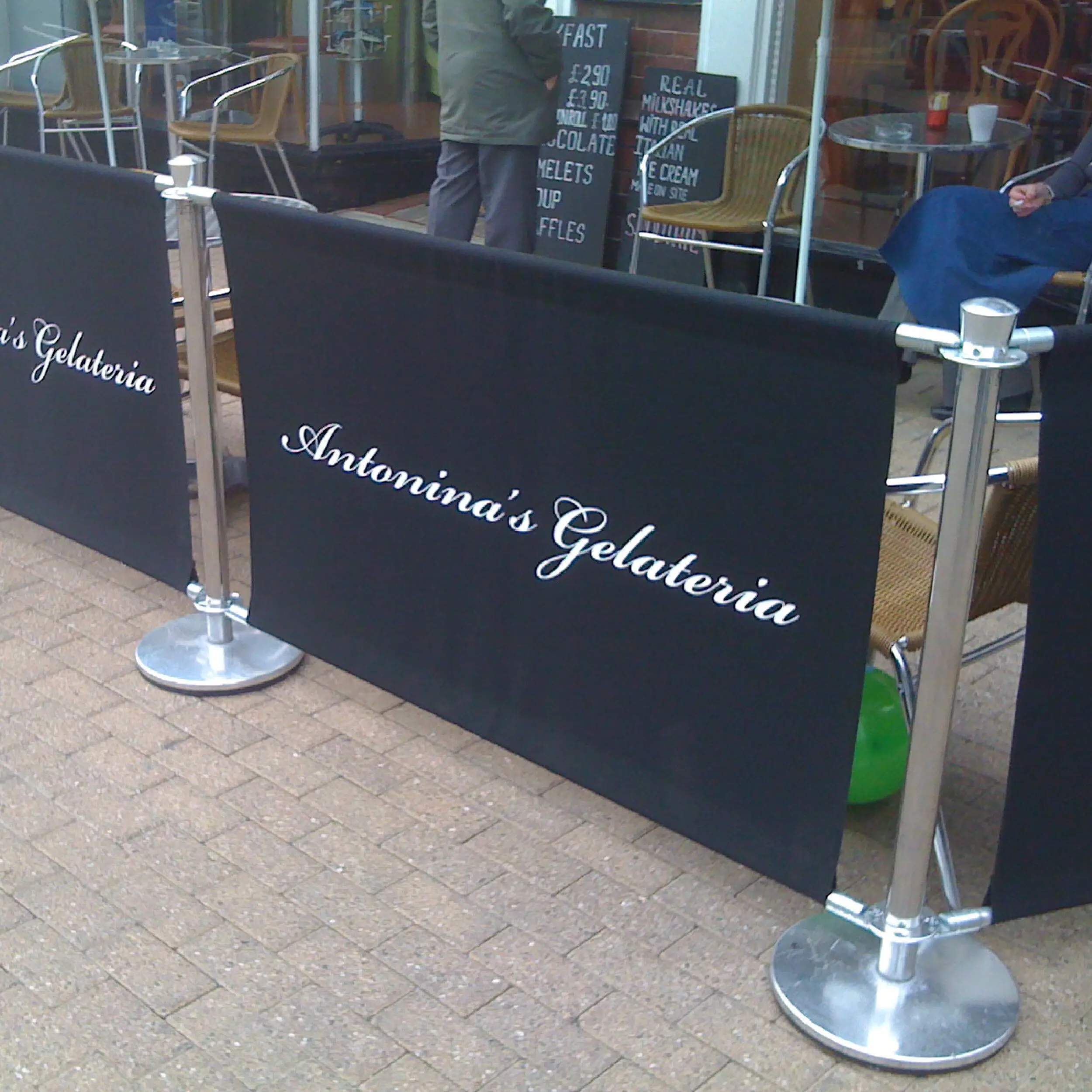 Antonina's Gelateria - Original Cafe Barrier Posts & Canvas Cafe Banners Antonina's Gelateria Cafe Barrier System, printed café banners, bespoke café banners, handmade café banners, custom café banners, café screens, fabric café banners, Original Cafe Barrier Posts, bespoke cafe barrier posts, stainless steel cafe barrier posts, metal stanchions, cafe screens