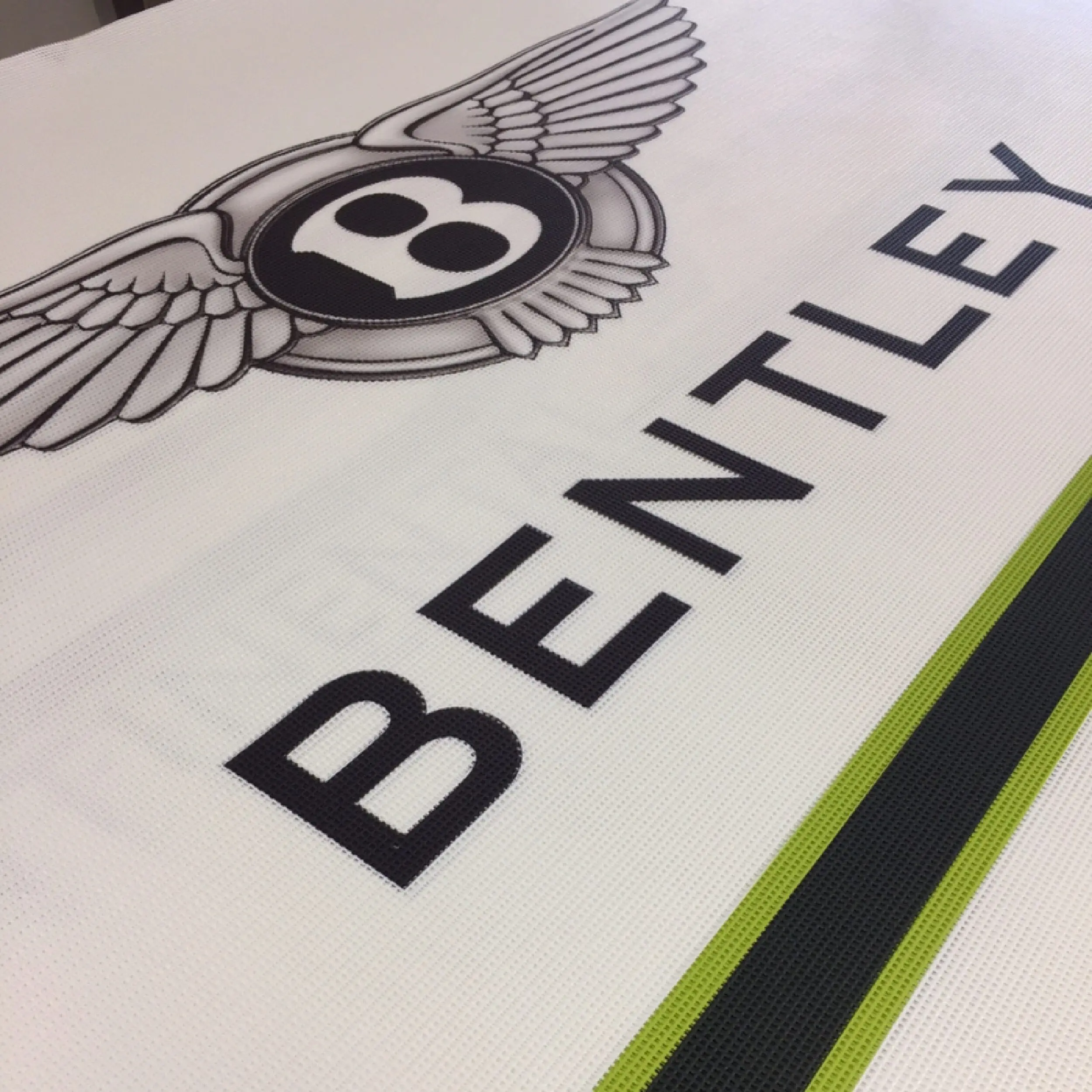 Bentley - Mesh Cafe Banner Full print perforated PVC cafe banners for Bentley, durable for indoor and outdoor commercial use. Affordable & long-lasting