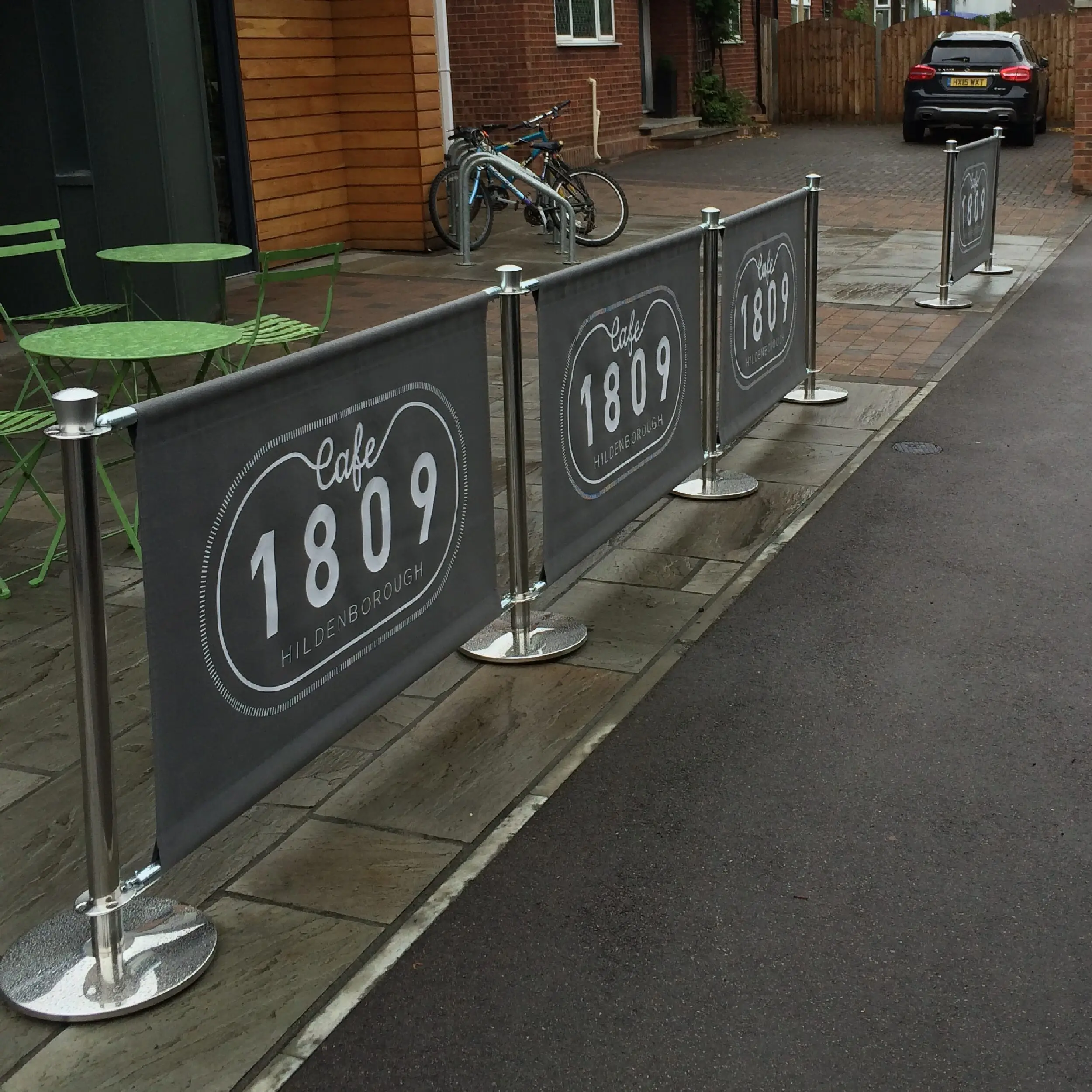 Cafe 1809 - Original Cafe Barrier Posts & Canvas Cafe Banners Cafe 1809 Cafe Barrier System, printed café banners, bespoke café banners, handmade café banners, custom café banners, café screens, fabric café banners, original cafe barrier post, bespoke cafe barrier posts, stainless steel cafe barrier posts, metal stanchions