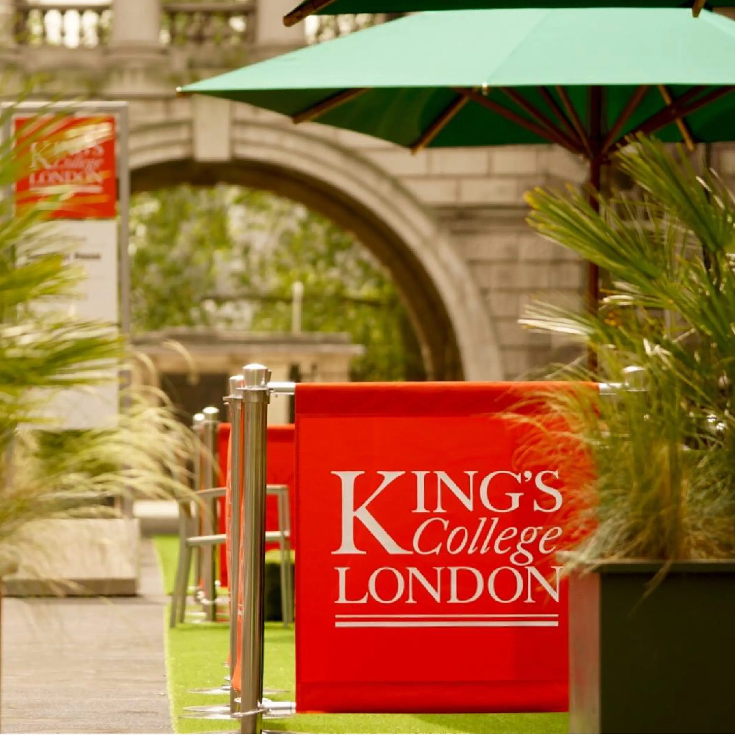 King's College London - Original Cafe Barrier Posts & Canvas Cafe Banners King's College London - Red Canvas Cafe Banners with Free Standing Original Cafe Barrier Posts, Printed Café Banners, bespoke café banners, handmade café banners, custom café banners, café screens, fabric café banners, stainless steel cafe barrier posts, metal stanchions, bespoke cafe barrier posts, Heavy duty cafe banners