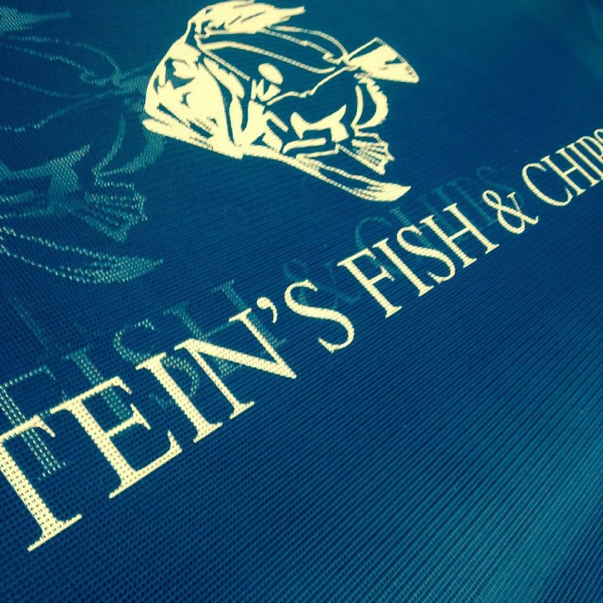 Stein's Fish & Chips - Mesh Cafe Banner Stein's Fish & Chips PVC Mesh Printed Cafe Banner, Bespoke Cafe Banners, Alfresco Cafe Panels, PVC Mesh Panels, Restaurant Panels, Commercial Cafe Panels, Custom Made PVC Mesh Panels, Digitally Printed Banners