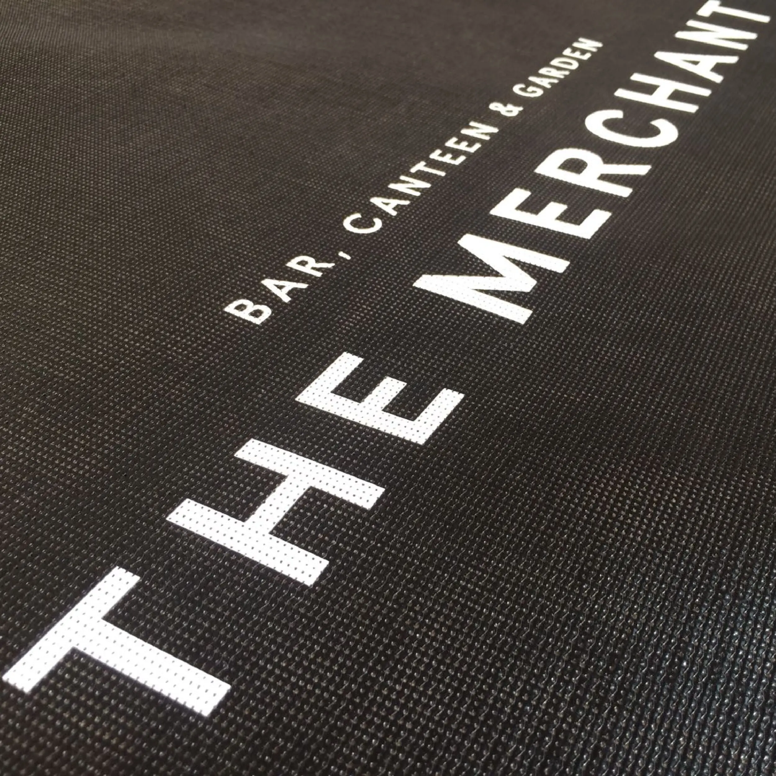 The Merchant - Mesh Cafe Banner The Merchant, Liverpool outdoor cafe banners in PVC perforated mesh vinyl, offering lasting durability and vibrant design.